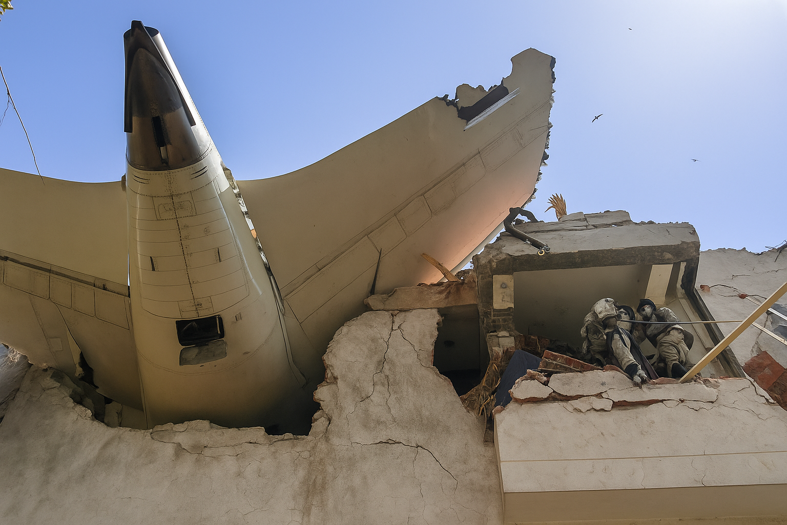 Air India plane crash Ahmedabad June 12 2025 – tail section embedded in Meghani Nagar building